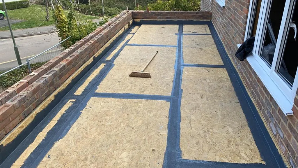 A new timber deck laid on a flat roof extension, ready for its covering